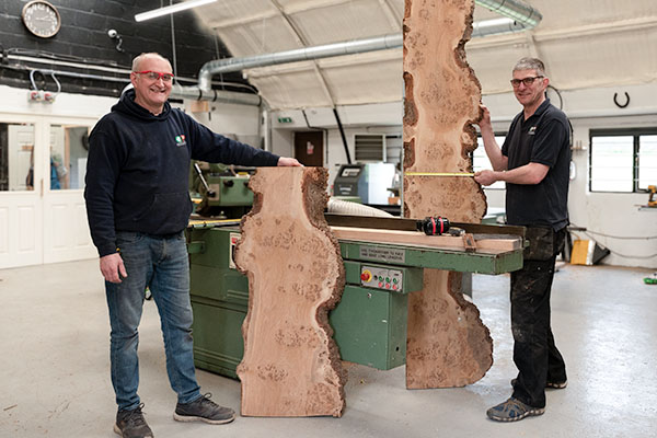 handmade oak furniture being built by 2 men